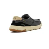 Zapato casual tipo slip-on de color gris oscuro, con detalles elásticos laterales para fácil calce, suela clara con efecto salpicado y refuerzo negro en el talón con la inscripción Country.