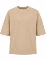 Remera de algodón color beige con textura waffle, de manga corta y corte oversize.