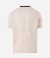 Remera polo de manga corta con textura retilínea, cuello polo en color verde contrastante y apertura frontal. Confeccionada en tejido de poliéster y algodón.