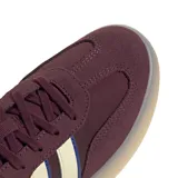 Championes Adidas Barreda Decode color bordó con las tres tiras laterales en color crema con borde azul.