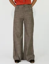 Pantalon de lino a rayas verticales de corte ancho y relajado, con cintura elastizada.