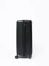 Valija rígida de 28 pulgadas color negro con diseño texturizado, manija retráctil, ruedas giratorias y candado de seguridad integrado.