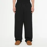 Pantalón de estilo deportivo con corte baggy oversized, confeccionado en tela pesada de alta calidad. Presenta cintura elástica ajustable y diseño de pierna recta y holgada.