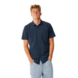 Camisa de manga corta azul marino con tecnología Vaporcool y Aerotech, tejido elástico y respirable, cuello camisero, cierre frontal de botones y un bolsillo en el pecho.