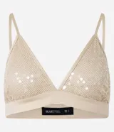 Top cropped femenino con escote en V, breteles finos ajustables y tejido cubierto de lentejuelas.