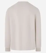 Buzo de algodón y poliéster color beige, con cuello redondo, mangas largas y puños ajustados. Diseño liso y minimalista.