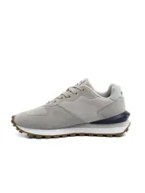 Championes urbanos Umbro para hombre, de color negro con detalles en gris y suela dentada bicolor en blanco y negro.