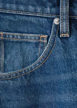Jeans Orlando de corte wide leg y tiro medio, en tono azul clásico con efecto desgastado.