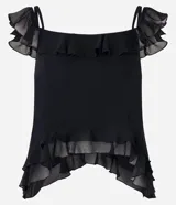 Blusa corta de breteles finos, confeccionada en chiffon negro con volados en los hombros y en el bajo. Tiene forro y punta alargada.
