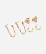 Set de tres pares de aros dorados: un par colgantes con cadena y dijes de cristal de colores, un par con dijes de cristal de colores y un par tipo argolla.