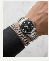 Pulsera de eslabones tipo cubana fabricada en acero, con engarzado de micropave de circonias en toda su superficie.