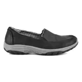 Mocasines Skechers Relaxed Fit Reggae Fest 2.0 Textbook color negro con suela gris. Capellada de microcuero con forro estampado pata de gallo y plantilla acolchada Air-Cooled Memory Foam.
