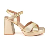 Sandalias de tacón alto Usaflex Party color beige, con capellada de cuero, forro Usa Care y tiras cruzadas en el empeine.