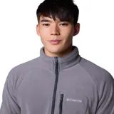 Buzo de polar Columbia con cierre frontal parcial, cuello alto y bolsillo con cierre en el pecho. Diseño de manga larga con ajuste cómodo.