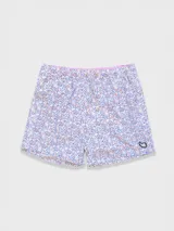 Short de baño rosado con estampado de lunares blancos, cintura elástica con cordón ajustable, bolsillos laterales y trasero con cierre, y suspensor de malla fina hipoalergénica.