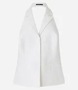 Chaleco blanco de tweed texturizado con espalda abierta, botones delanteros y solapas.