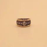 Anillo ancho de plata 925 con detalles en oro y circonias.
