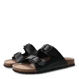 Sandalias tipo Birkenstock de color negro, con doble tira ajustable mediante hebillas metálicas y plantilla anatómica con base de corcho.