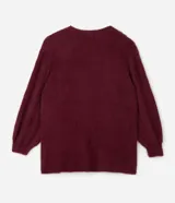 Cardigan abierto de punto pesado con textura peludita, manga larga y diseño alargado. Prenda versátil de corte holgado.