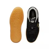 Championes Puma Palermo de gamuza negra con franja lateral blanca y suela de goma color caramelo.