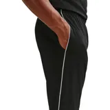 Pantalón deportivo Nike Dri-Fit Park, color negro, con ajuste entallado, cintura elástica y logo de la marca bordado en blanco en el muslo izquierdo.