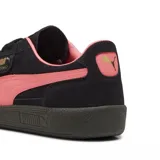 Championes Puma Palermo negros con detalles en blanco y suela color caramelo.