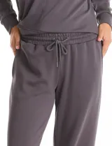 Pantalón jogger de corte recto, color blanco, con cintura elástica, cordón de ajuste y bolsillos laterales.