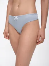 Colaless blanca de algodón con ribete negro y moño negro en el centro.