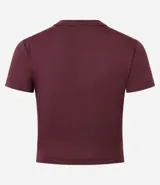 Blusa cropped de manga corta y cuello redondo, confeccionada en tejido rib acanalado de color marrón oscuro.