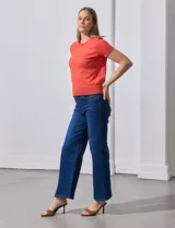 Buzo tejido en hilado fino color naranja, marca Ninety.