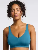 Bralette de diseño minimalista y acabado invisible, sin aros, con pads removibles y tiras regulables. Presenta una silueta con espalda en U que brinda soporte y suavidad.