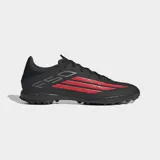Championes de fútbol Adidas F50 League para césped artificial, color negro con detalles en rojo y blanco. Presentan un empeine de Fiberskin con estampado Sprintgrid y lengüeta envolvente para un ajuste ceñido.