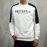 Buzo blanco de algodón con mangas raglán negras y estampa frontal con la palabra "UNSTOPPLE" y la frase "DUXON COLLECTION" en negro.