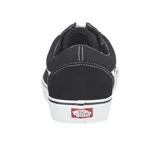 Championes Vans modelo Old Skool, de diseño clásico con capellada de gamuza y lona en color negro, con la icónica banda lateral blanca y suela de goma vulcanizada.