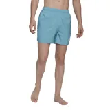 Short de baño celeste con logo de Adidas en la pierna derecha.