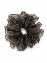 Colero para el cabello con diseño voluminoso y estampado animal print de leopardo en tonos marrones y negros.