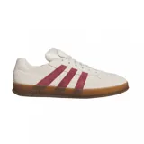 Championes urbanos Adidas modelo Aloha Super, color beige con las icónicas tres tiras en color bordó y suela de goma color caramelo.
