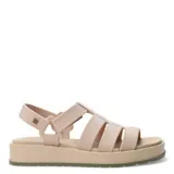 Sandalias de plataforma tipo jaula con tiras anchas de material sintético en color blanco hueso, cierre de velcro en el tobillo y suela de goma negra con base color caramelo.