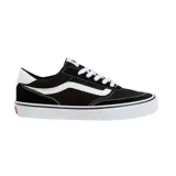 Championes Vans modelo Brooklyn LS, de diseño minimalista en color negro con detalles en blanco. Presentan la icónica franja lateral de la marca, cordones blancos y suela de goma vulcanizada con refuerzo en la puntera.