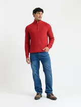 Sweater de punto inglés color verde, con cuello alto y cierre frontal parcial metálico. Diseño de manga larga con puños y ruedo acanalados.