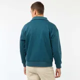 Buzo de algodón color azul petróleo, con cuello tipo camionero y cierre frontal parcial con cremallera. Presenta puños y cintura acanalados.