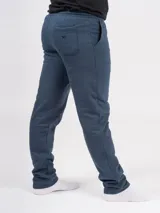 Pantalón deportivo azul petróleo, de corte recto y tiro alto, con cintura elástica ajustable con cordón.