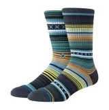 Medias de caña media Stance con diseño de rayas horizontales multicolores y patrón de cruces. Incluye logo de la marca bordado en el lateral.