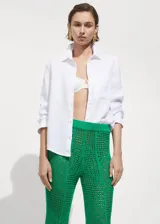 Pantalon de punto calado color verde, con diseño wideleg y cintura elástica.