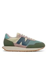 Championes deportivos New Balance modelo WS237 en diseño multicolor con combinaciones de verde militar, rosado, celeste, beige y azul, con la característica 'N' en los laterales y suela dentada de goma.