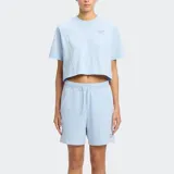 Remera Reebok Icon Elements color celeste, de corte cropped y mangas cortas.