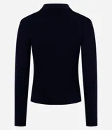 Blusa de punto acanalado marca Blue Steel, con cuello polo estructurado y cierre parcial con cremallera. Presenta un diseño ajustado de manga larga y acabado recto en el ruedo.