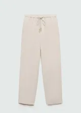Pantalón de lino color beige, de corte recto y diseño relaxed con cintura elástica y cordón ajustable.