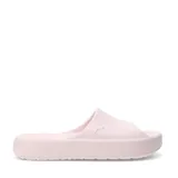Chanclas Puma modelo Shibui Cat, color negro, con diseño minimalista de una sola pieza y plataforma. Presenta el logo de la marca grabado en el lateral.