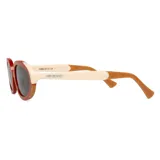 Lentes de sol Mr Boho modelo Solarte con armazón ovalado de acetato en color terracota y detalles en crema en las varillas. Lentes oscuros con protección UV.